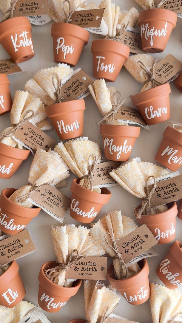 13 Cute and Fun Wedding Ideas for Guests Your Guests Will Love 12 Small terracotta pots with guest names and napkins used as wedding party favors.