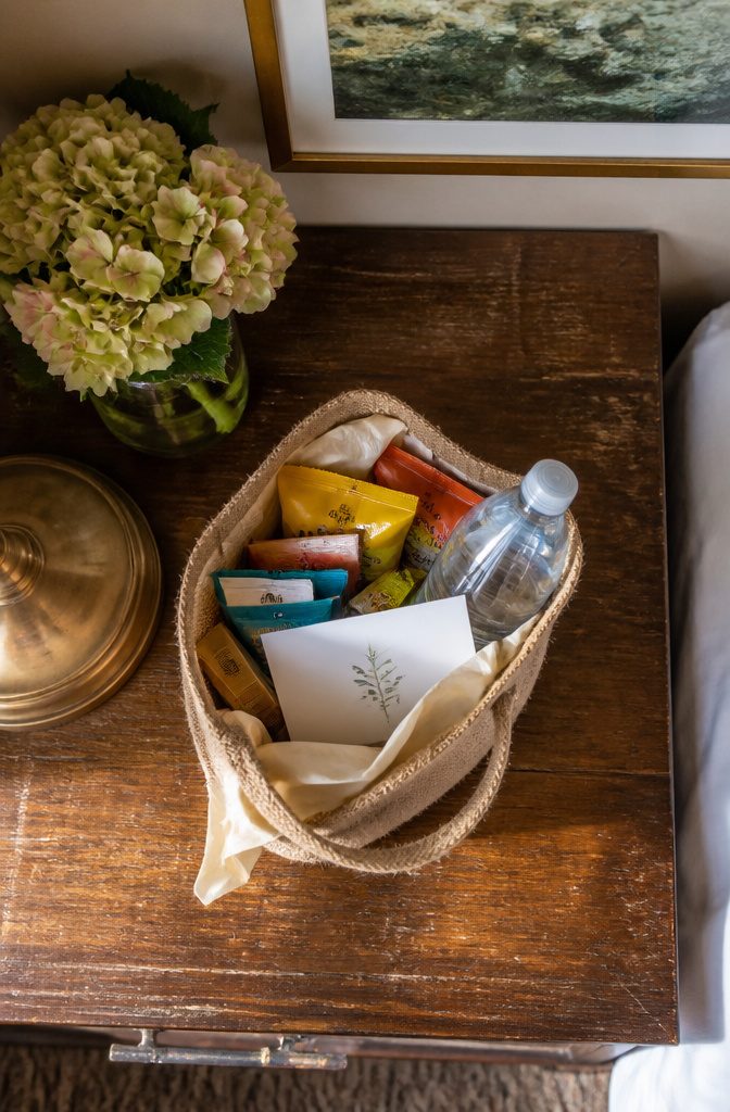 Welcome bags with snacks and personalized notes for wedding guests.
