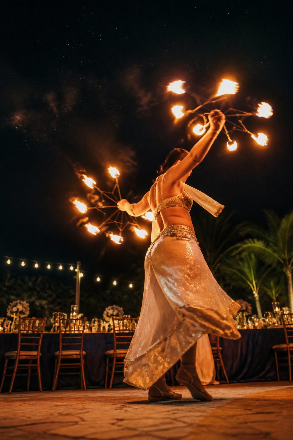 A fire dancer showcasing their skills at a wedding.