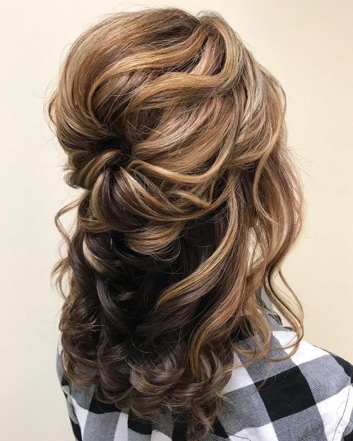 Long Hair Half Up for Wedding: 10 Styles That Work 2 Long light brown hair styled in a half-updo with large, loose, voluminous curls.