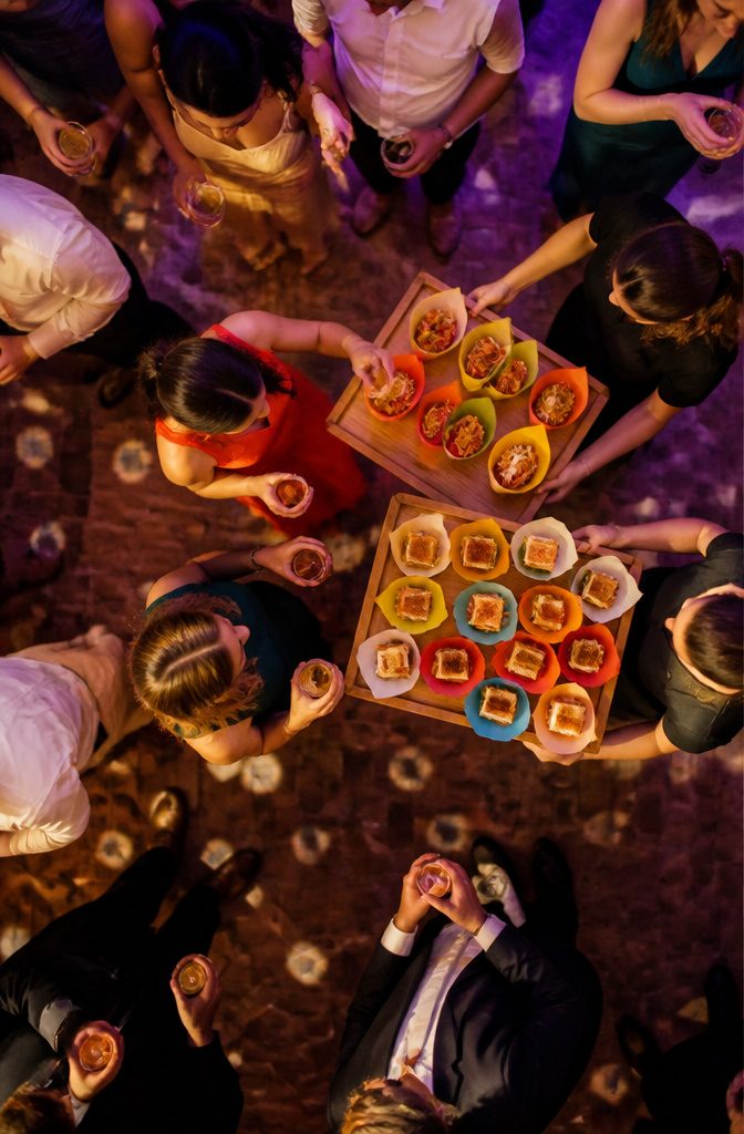 20 Special Wedding Ideas for a 2026 Celebration You'll Remember 16 Servers circulate with mini grilled cheese and warm churros at a wedding.