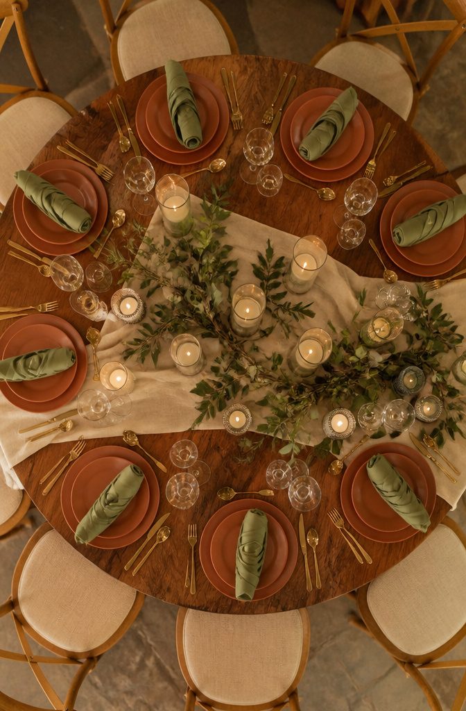 10 Terracotta and Sage Wedding Decor Ideas for Your Reception 8 Sage green napkins folded beside terracotta dishware.