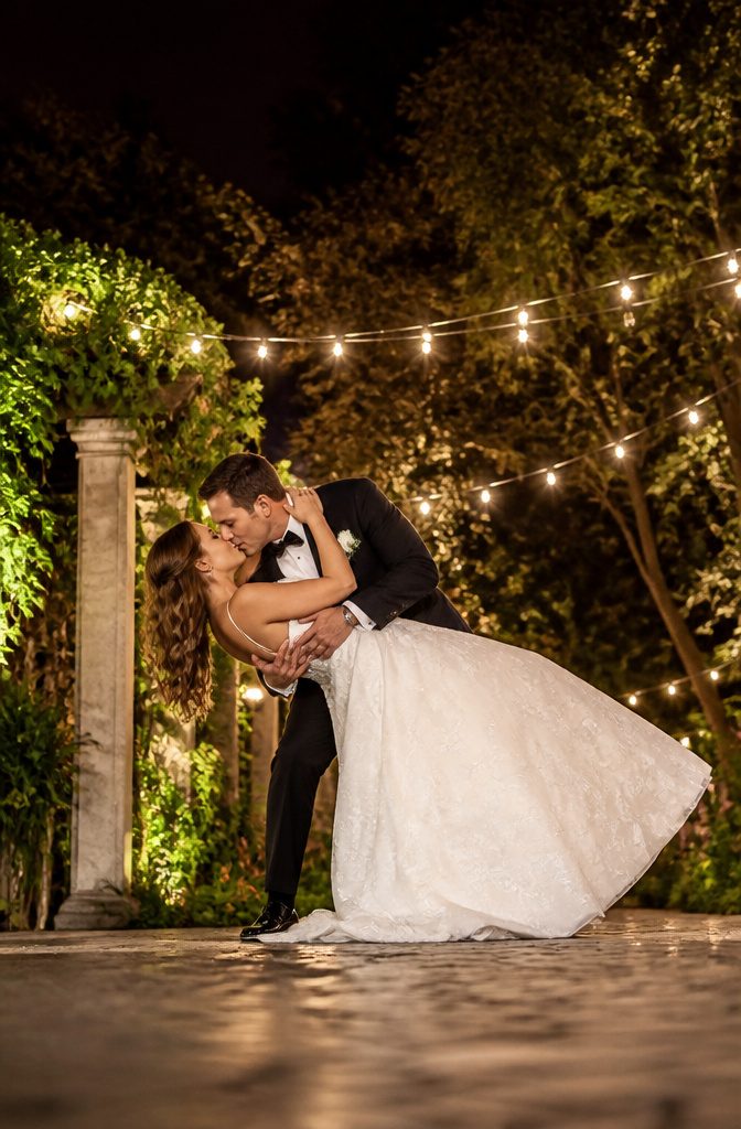 Couple in a dip pose during their wedding photoshoot.