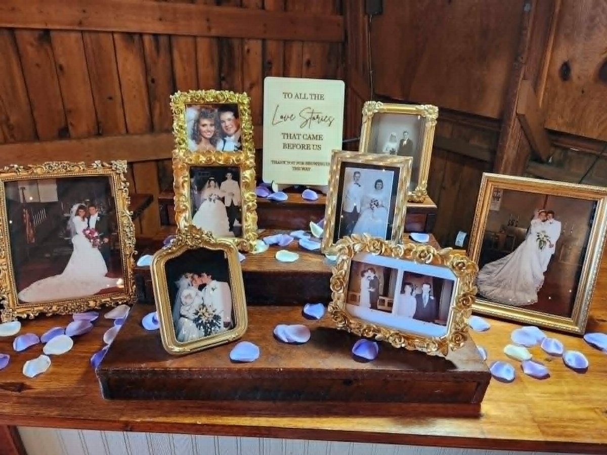 20 Wedding Decor DIY Ideas for Ceremony and Reception 5 Ornate gold picture frames with wedding photos arranged on wooden trays with flower petals.