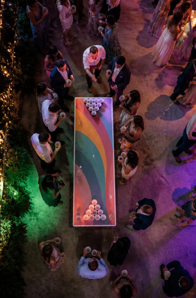 20 Wedding Reception Ideas for a 2026 Party Guests Won't Forget 8 A beer pong setup at a wedding reception.