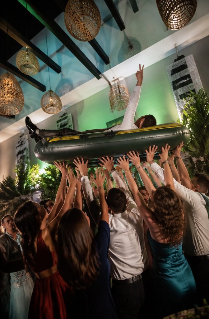 20 Wedding Reception Ideas for a 2026 Party Guests Won't Forget 5 A guest crowd surfing during a wedding reception.