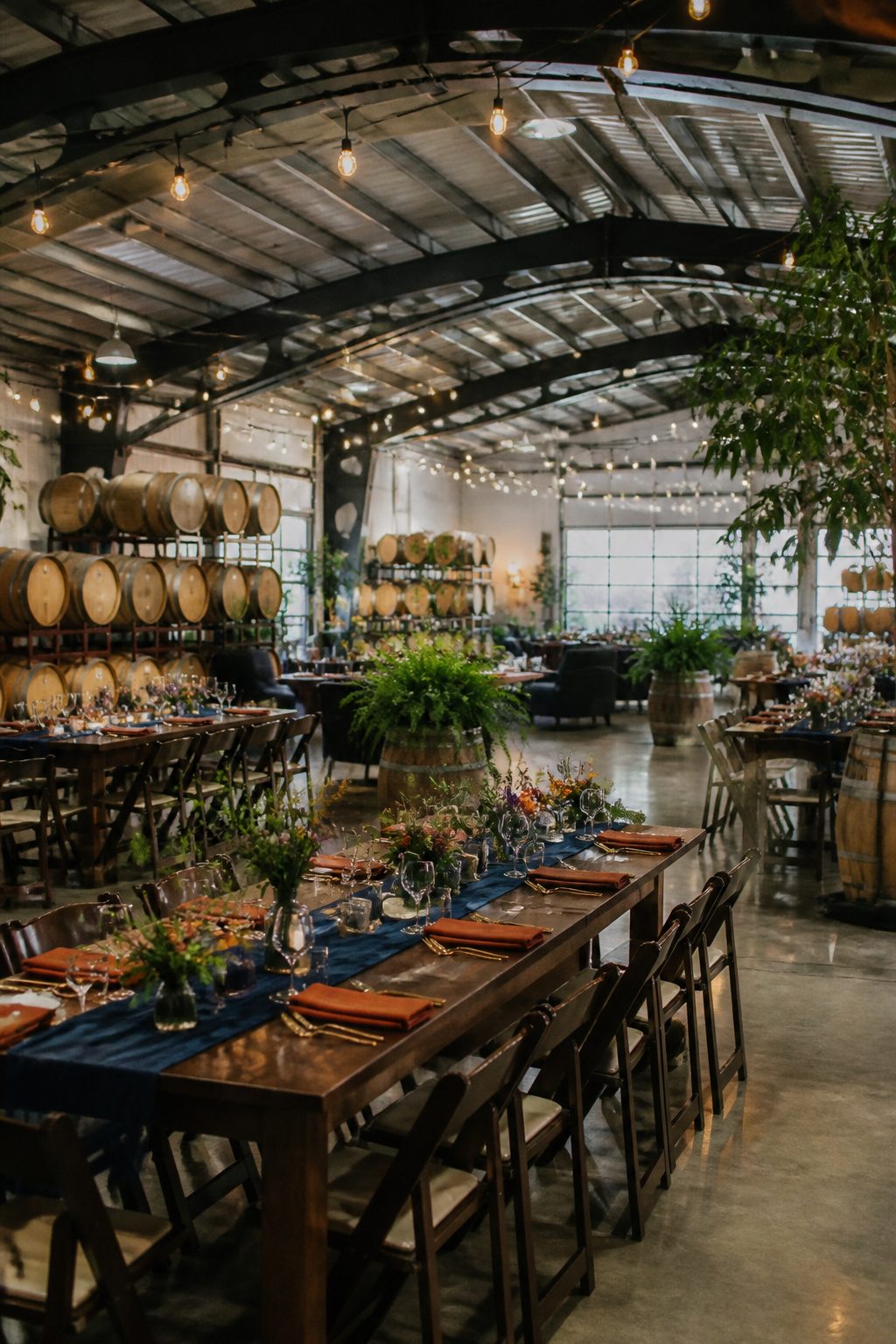 9 Indoor Wedding Venue Ideas for 2026: From Warehouses to Museums 7 Interior of Coopers Hall Winery with arched ceilings and long tables.